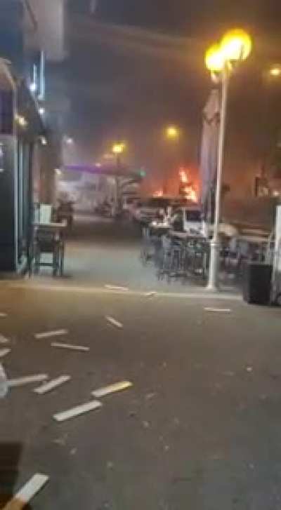 Bus gets hit by a missile in Israel, but that won't stop this guy from finishing his meal