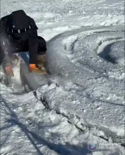 This guy carved out a giant snake from ice