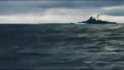 Battleship Bismarck firing at HMS Hood during the Battle of the Denmark Strait.