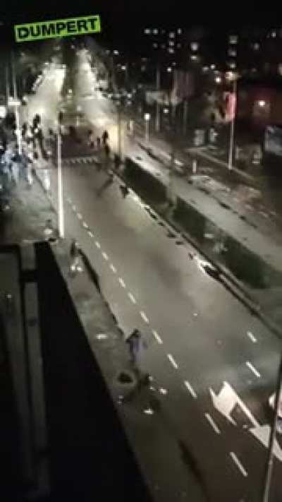 Rioters throw rocks at police Haarlem, The Netherlands