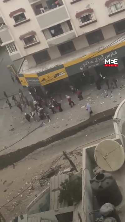 Israel snipes shot a Palestinian woman waving a white flag, child by her side in Gaza