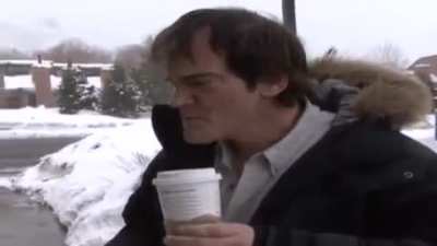 Quentin Tarantino slaps a rude paparazzi.