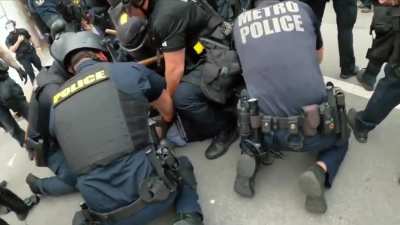 Louisville police arrest 2 people and confiscate firearm
