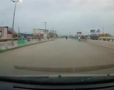 Idiot on a bike learns the hard way to not zig zag on the road