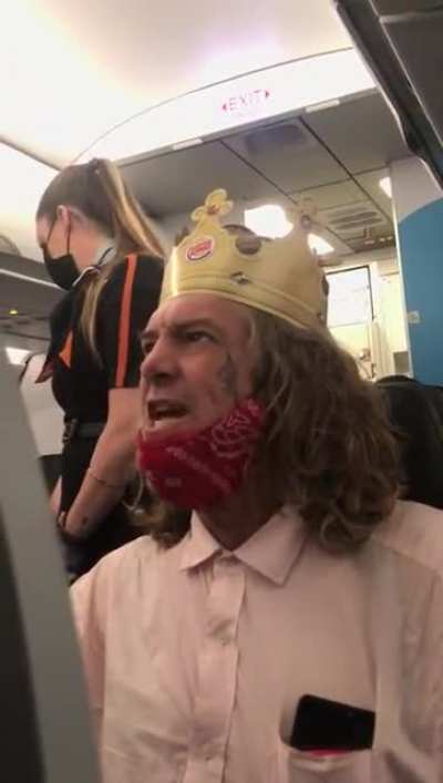 Racist man wearing Burger King Crown is kicked off plane (Warning: lots of swearing & n-words)