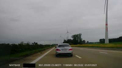 Crazy German on E24 in Belgium. First 50 seconds to show I didn't do anything to warrant this behaviour. Later on, he picked another road fight with the Belgian Peugeot passing us on the right at 2min 30sec into the video. I then decided to call the polic