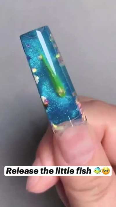 Putting a live fish in your nail as nail art... WTF