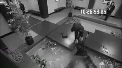 A businessman, at least 46 years of age falls into a Koi pond after a business meeting with a very formal company, his business associate failing to help him as he was practicing “a killer dance move.”