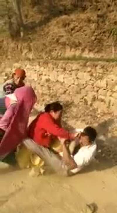 Abusing a woman in public with other women around