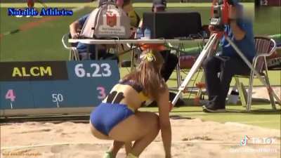 A young girls reaction to beating her long jump record, and her parents are super proud in the crowd!