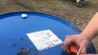 A firework rocket in an old oil barrel.
