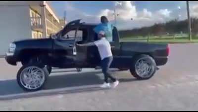 HMFT after dancing beside a lifted pickup truck