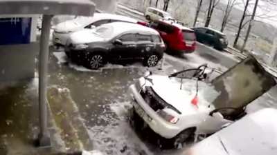 Man clearing the snow off his car