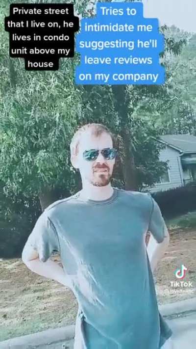White man questions black woman parked in front of her own house.