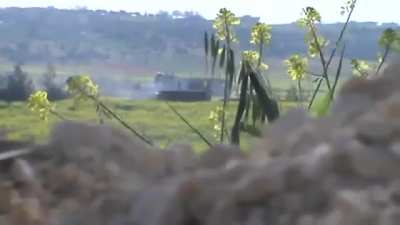 Camera set up to film an ambush on an SAA tank is knocked over by return fire - Hish, Idlib - 4/6/2013