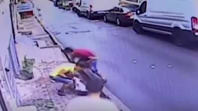 Teenager saves baby falling from second floor window.