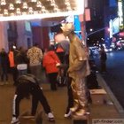 Stealing a statues money