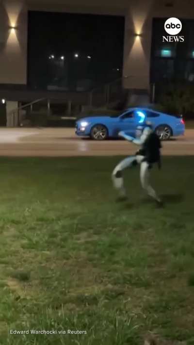 Video of a humanoid robot chasing wild boars out of a Warsaw neighbourhood.