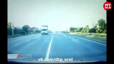 Mitsubishi Lancer makes contact with a truck and loses control swerving into opposite lane. Both the driver and passenger of Mitsubishi died.