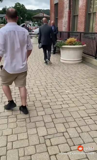 Lawyer smacks another lawyer at court house.