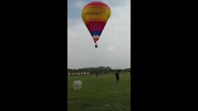 Someone falls from a hot air balloon.