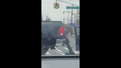 Tow truck trying to take car with guy still in it