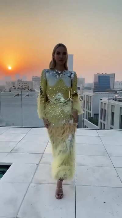 Trying on haute couture dresses on the rooftop