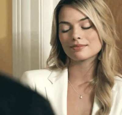 Margot Robbie lookin like she’s hoping you invite her inside to seal the deal for a leading role...
