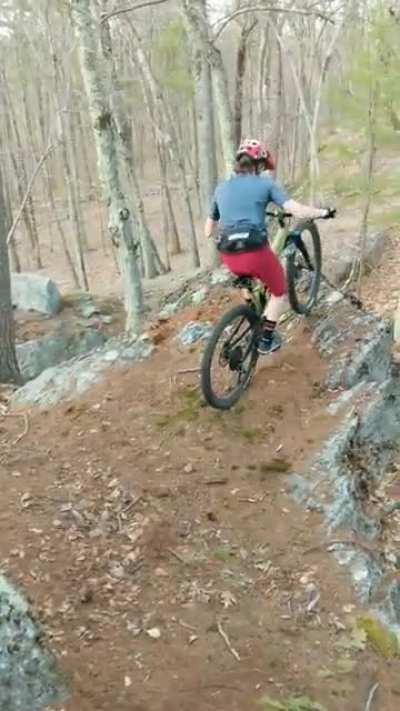 Riding a sketchy line on the local trails.