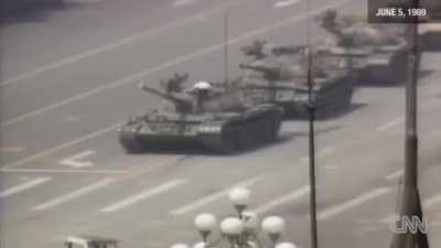 [June 5th, 1989] A man only known as the so called ”Tank Man” attempting to stop the tanks in the midst of the Tiananmen Square Massacre in China.