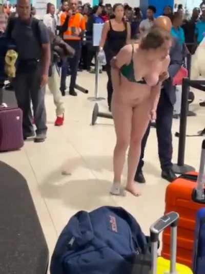 Woman Strips Naked at Jamaica Airport, Gropes a Police Officer, Flashes Everyone and asks cops to tase her on her genitals 🤮
