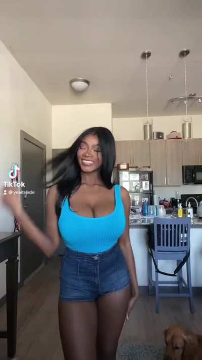 That tank top is barely holding those