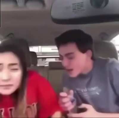 What is he doing with his sister?