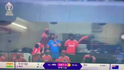 Virat Kohli trying to find Anushka Sharma on the upper tier of the stand from the dressing room during the India vs New Zealand Semifinal match.