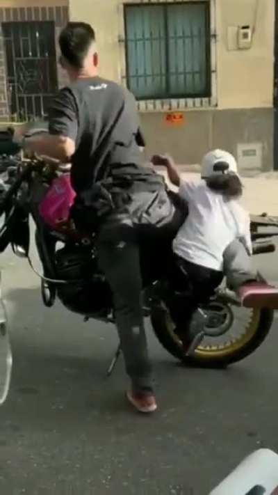 getting off a motorbike in style