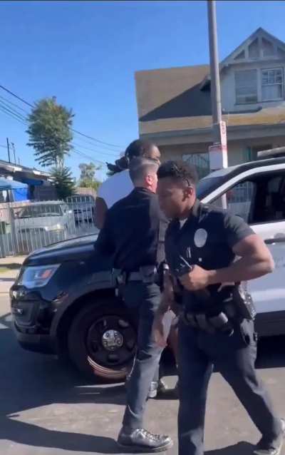 LAPD officer punches a suspect that was not resisting in the mouth for asking a question