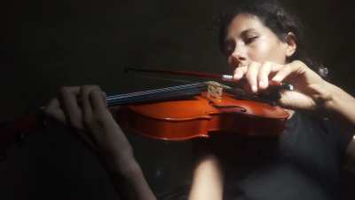 Practicing scales on violin