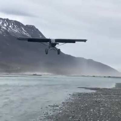 STOL (short takeoff and landing) aircraft in strong headwinds is virtually hovering mid-air during landing