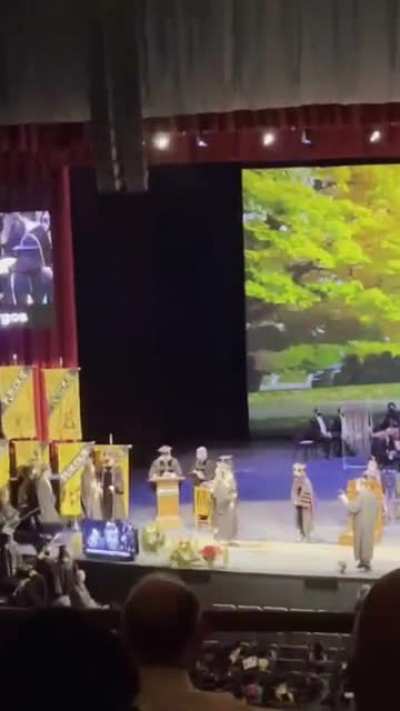 This guy ruining my gf’s video of me graduating…