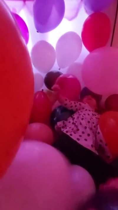 My little niece in her balloon tent.