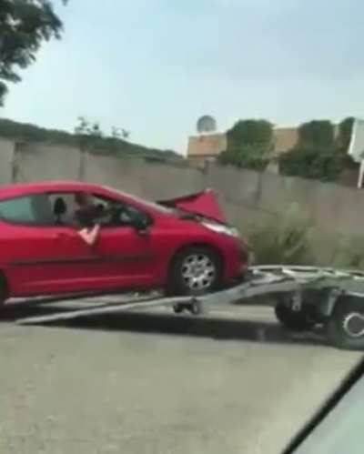 Interesting way to pull a car.