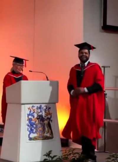 Daughter cheers for her dad at his graduation.💙