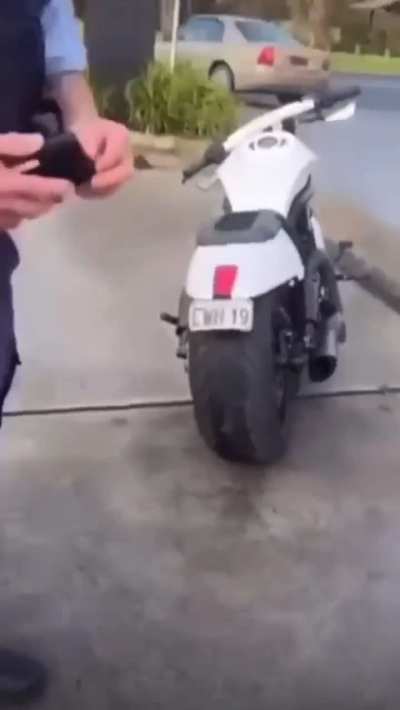 Cop thinks blinkers are too close together. Owner of the bike has a freakout.