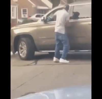 NSFW: Guy scraps with a woman in her car, she drives over his legs