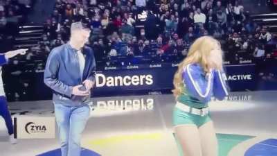 Cheerleader out of step with routine for the best possible reason