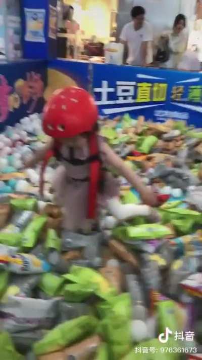 The object of this game is to be attached to a harness and grab as many chips as possible