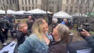 Scuffle with MAGA woman triggered by banner outside Manhattan court house that reads 