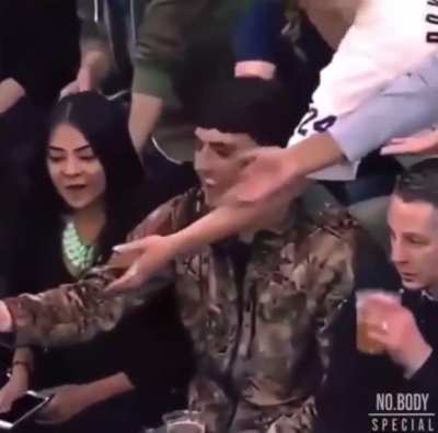 Girl steals wristband dude caught from Kobe. It’s amazing how she shows no shame or really any emotion towards her actions whatsoever.