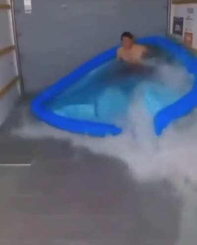 By putting enough water to drown in but not enough to cushion him