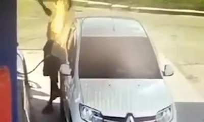Smoker sets himself on fire lighting a cigarette while filling his car up
